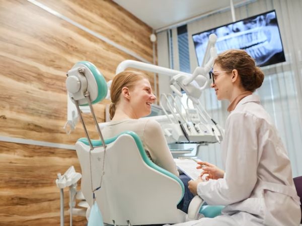 Dentist clinic chair or dentist consulting patient
